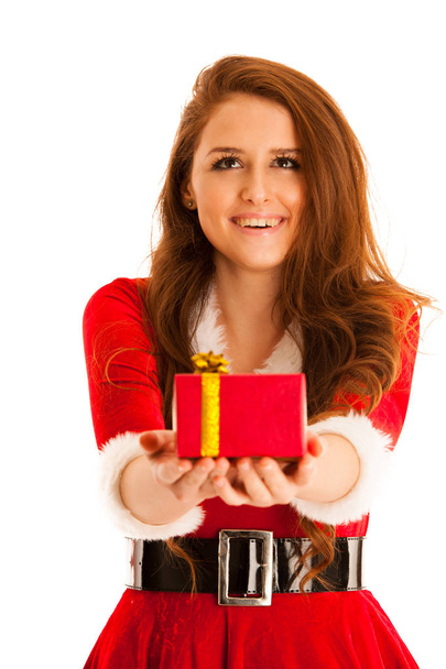 Cute brunete girl in santa claus dress with presents for christm - Foto, afbeelding