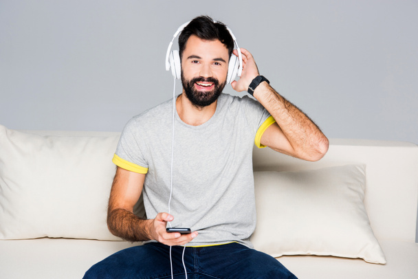 Bearded man in white headphones - Photo, Image