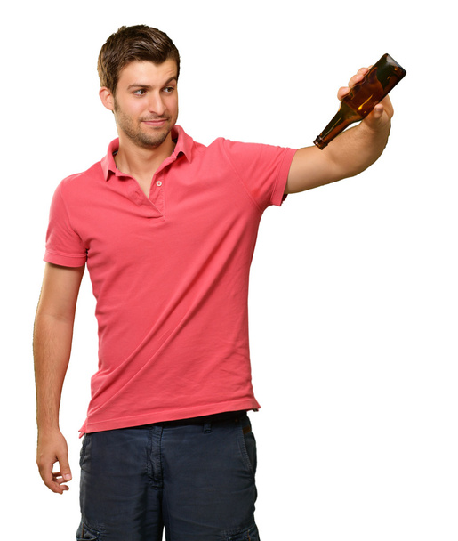 Portrait Of Young Man Holding Empty Bottle - Фото, зображення