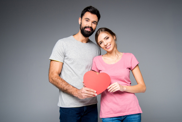 Young couple with red heart - Foto, immagini