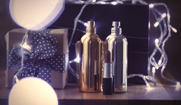 fairy lights and cosmetic bottles - Foto, Imagem