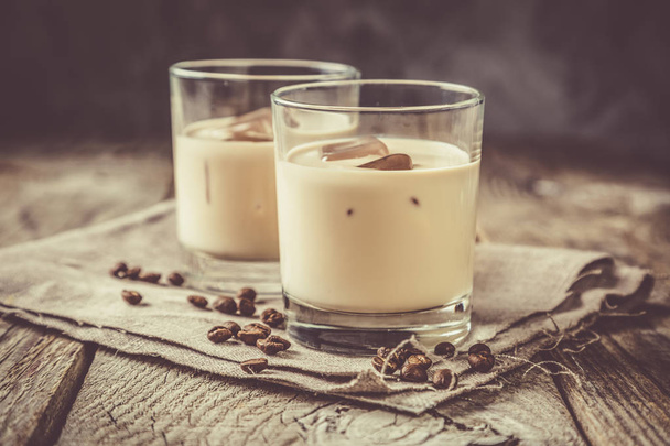 Coffee liqueur in glasses with ice and beans - Photo, image