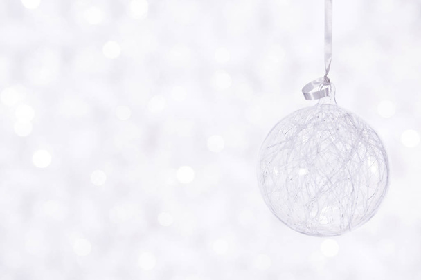 Beautiful shiny ball on a winter background - Fotografie, Obrázek