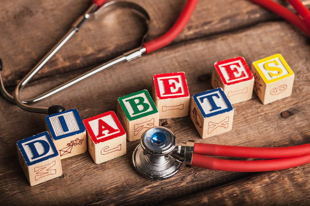 Cubes with word diabetes and stethoscope - Photo, Image