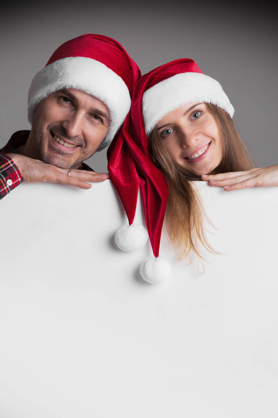 Couple in Santa's hats - Photo, Image