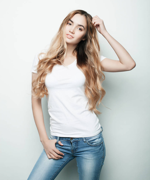 fashion model posing in studio, white background - Φωτογραφία, εικόνα