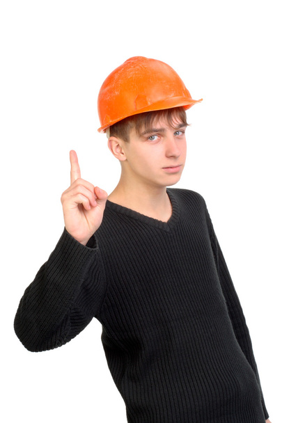 Teenager in hard hat - Фото, изображение