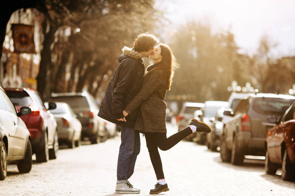 guy and the girl kissing on city street - Photo, image