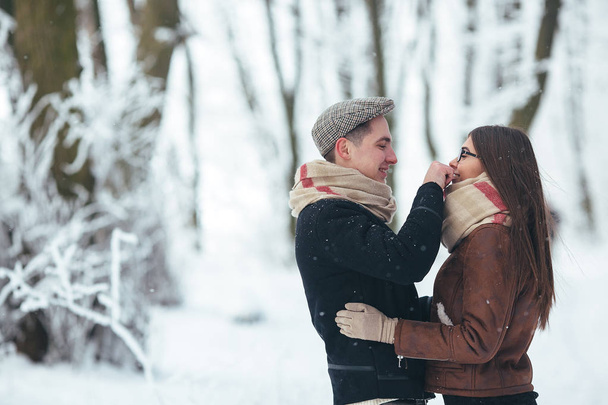 Happy couple in snow park - Photo, Image