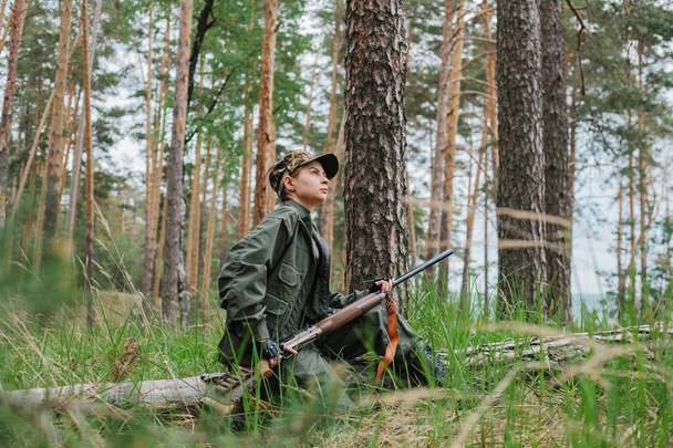 Woman hunter in the woods - Photo, Image