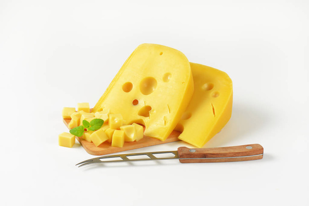 Wedges and cubes of Swiss cheese - Φωτογραφία, εικόνα
