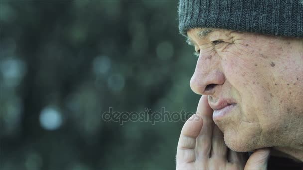 sad and thoughtful old man sitting deep in his thoughts  - Footage, Video