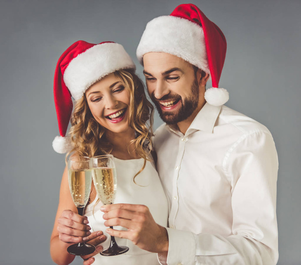 Beautiful couple celebrating Christmas - Фото, зображення