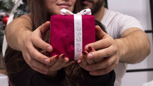 Hands of couple giving Christmas gift - Photo, Image