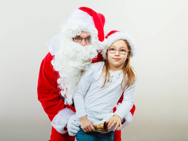 Santa claus with little girl. - Foto, Bild