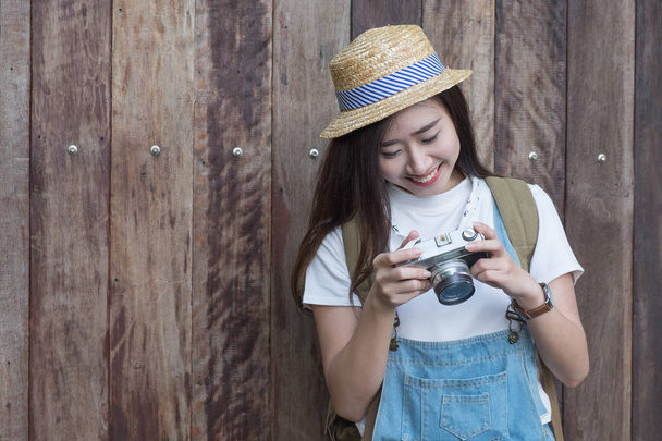 Young asian butiful woman with camera. in a blue shirt. Hipster  - Photo, Image