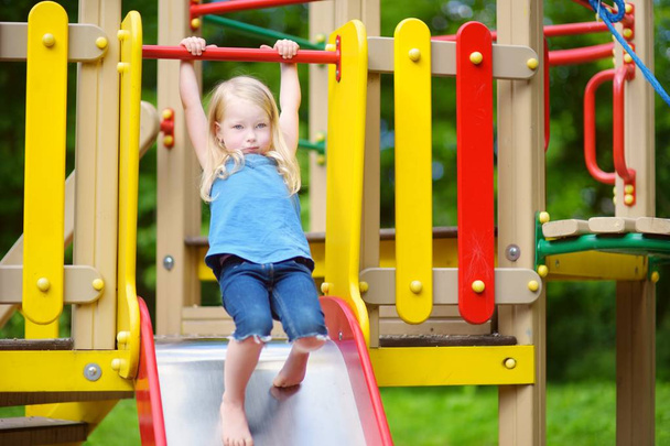girl having fun on playground - Foto, afbeelding