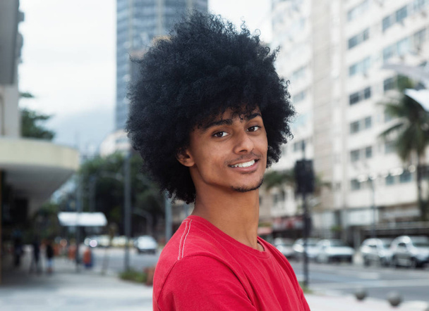 Laughing african american man with typical afro hair - Photo, image