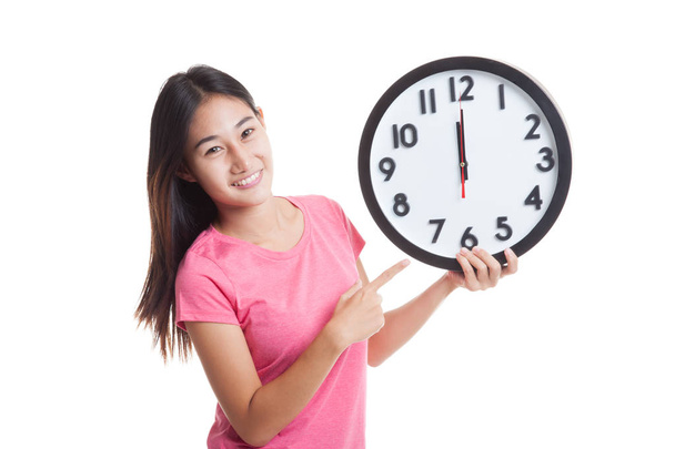 Young Asian woman point to a clock - Foto, Imagem