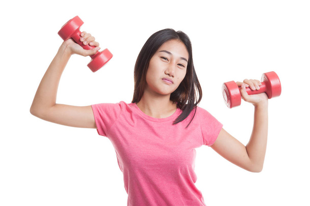 Exhausted Asian woman with dumbbells. - Foto, Imagen