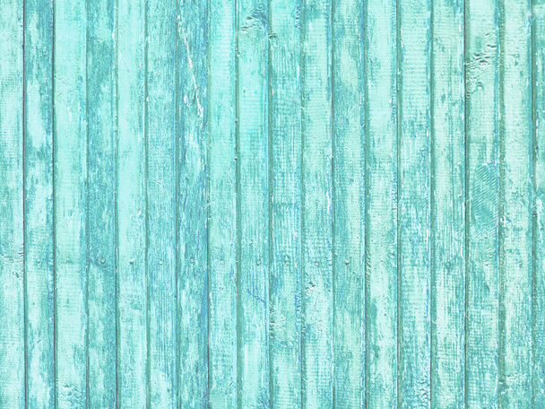 Old wooden painted light blue rustic background, paint peeling  - Photo, Image