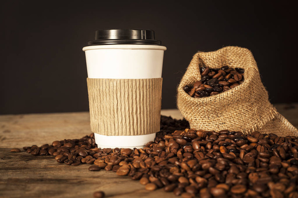 Paper cup of coffee on black background - Fotó, kép