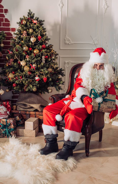 Santa Claus with gifts for Christmas - Photo, image