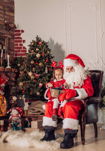 girl with gift box with santa claus - Фото, изображение