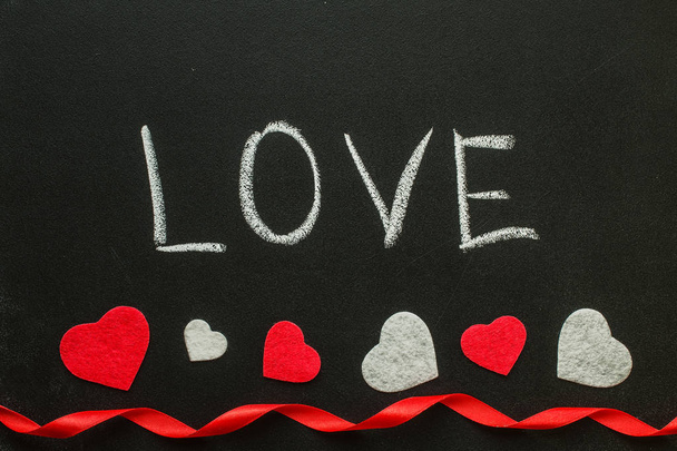 Love Hand écrit sur la planche à craie
.   - Photo, image