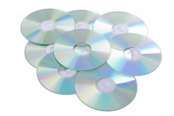 Discos compactos prateados isolados sobre fundo branco
 - Foto, Imagem