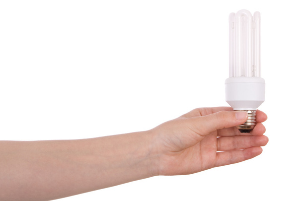 Hand hält Kompaktleuchtstofflampe isoliert auf weiß - Foto, Bild