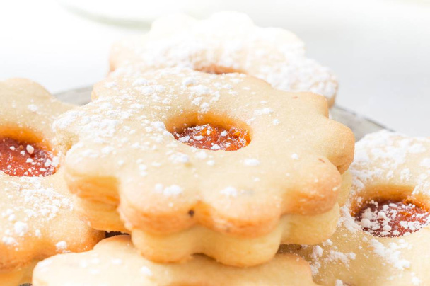Homemade apricot jam Linzer with icing sugar close up - Photo, Image