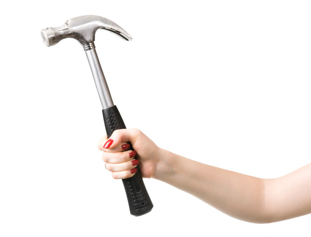 Woman hand with hammer - 写真・画像