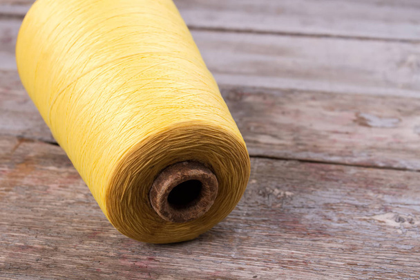 Beautiful big skein of yellow yarn. - 写真・画像