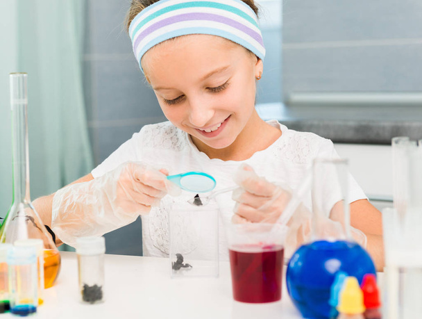 little girl with flasks for chemistry - Photo, Image