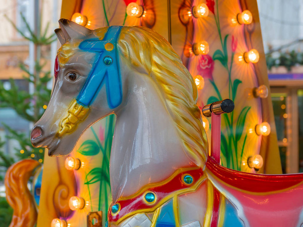 Colorful carousel or merry-go-round horse at the Christmas market - Φωτογραφία, εικόνα