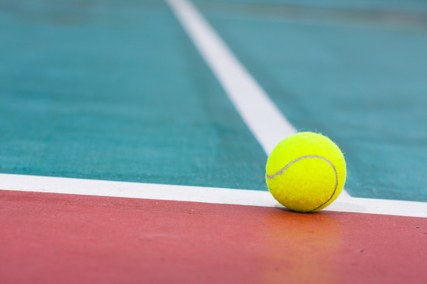 Tennis ball on the field. - Фото, изображение