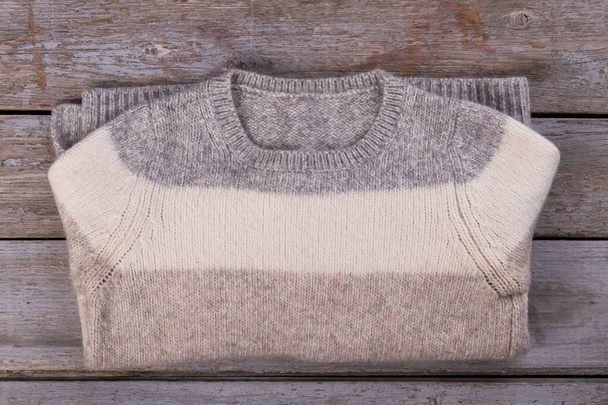 Beautiful three-color knitted sweater.  - Photo, Image