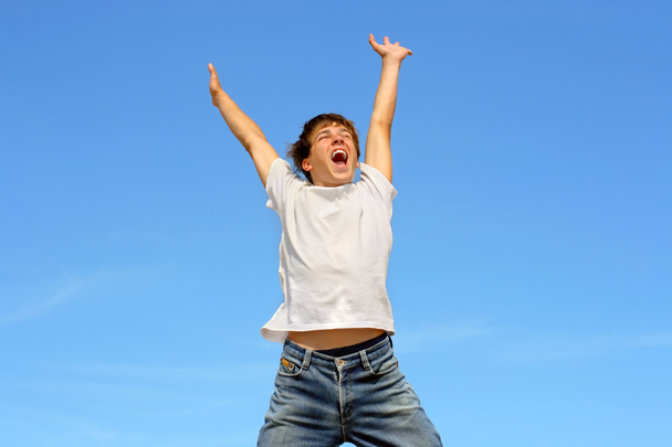 Happy teenager jumping - Фото, изображение