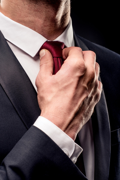 Businessman adjusting tie  - Foto, imagen