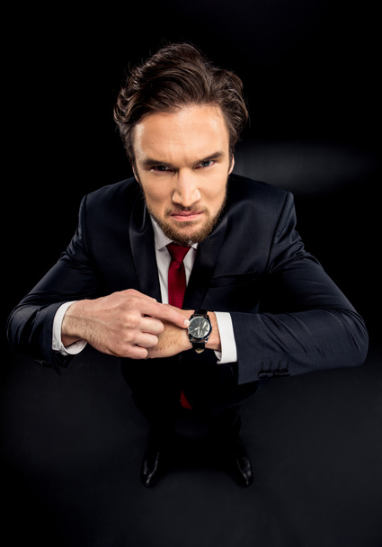 Businessman pointing at wristwatch - Foto, immagini