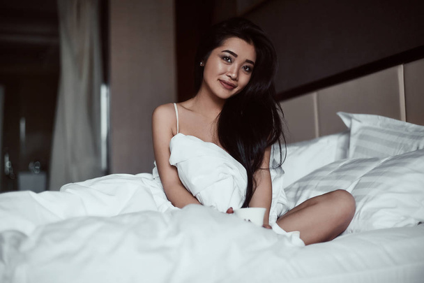 Portrait of a beautiful sensual asian woman with coffee - Foto, Imagem