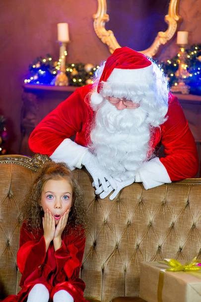 Santa Claus and girl with Christmas gifts - Foto, Imagen
