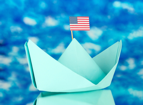 Ship with the American flag, on blue background. Columbus Day. - Photo, image