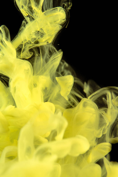  The yellow dye in the water. Abstract background. Wallpaper. Concept art - Foto, afbeelding