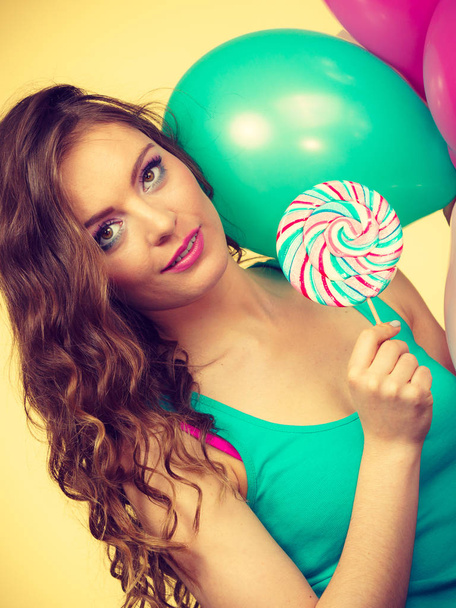 Woman with colorful balloons and lollipop - Фото, изображение