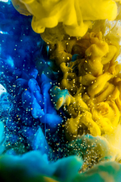  The colorful dye in the water. Abstract background. Wallpaper. Concept art - Фото, изображение