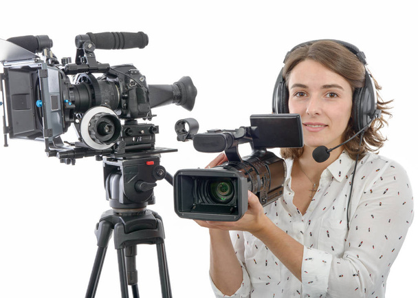 pretty young  girl with  professional camcorder, on white - Фото, зображення