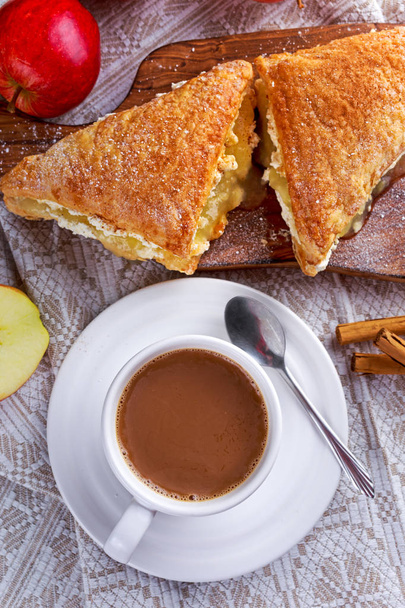 Puff pastry Turnovers apple cake dessert with whipped cream and hot coffee. - Photo, Image