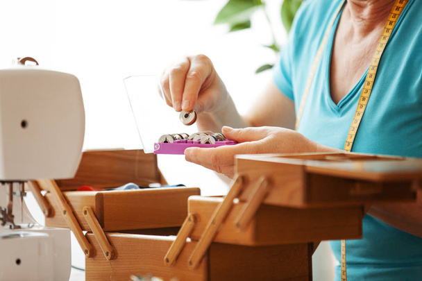 Senior woman sewing - Foto, immagini